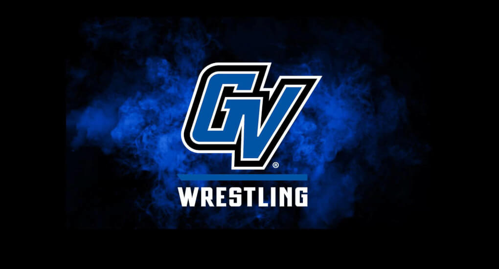 GV Wrestling athletics logo in front of a blue cloud of smoke on a black background